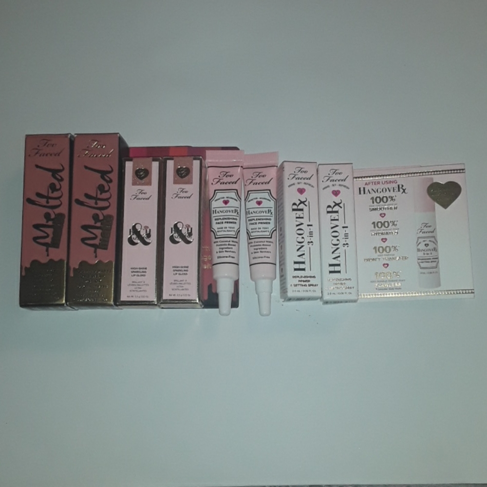 Too Faced minis 2 of each, lip gloss, face primer